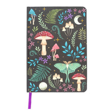 Load image into Gallery viewer, Dark Forest Print Notebook. This stunning A5 notebook has an ethereal dark forest design. Mystical mushrooms, a glowing luna moth and magickal plants are accented by gold foil page edges and a ribbon marker.  Perfect to use a spell book or to write all of your intentions down.