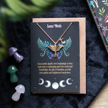 Load image into Gallery viewer, Luna Moth Necklace and Card. This ethereal luna moth necklace comes nestled on a matching greeting card, making it the perfect gift to celebrate new beginnings and personal growth. Includes gold-tone stainless steel moth and crescent moon charms on a 22cm nickel-free chain.  Includes envelope. Card left blank inside. 