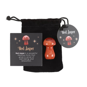 Red Jasper Mushroom.  Harness the power of crystal healing with this Magical Crystal Mushroom crafted from polished red jasper. This powerful stone promotes wellbeing and relaxation, radiating soothing energy that brings harmony and balance to your surroundings.  Comes in a drawstring bag for easy storage with a matching informational insert card.