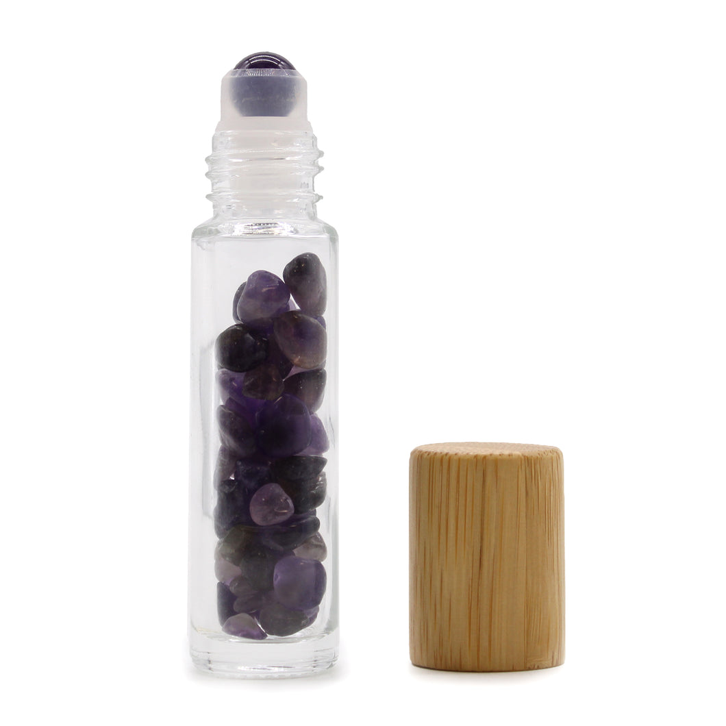 Amethyst Crystal Essential Oil Roller Bottle.  The roll-on bottle allows the oils to be applied precisely and easily to the skin. The ball is made of smoothly polished Amethyst. The stones placed inside provide a unique visual effect, it is also believed that they enhance the effect of the given mixture.