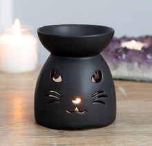 Load image into Gallery viewer, Black Cat Cut Out Oil Burner.  This black ceramic oil burner features a cut out cat design and a cool, matt finish.  Compatible with both fragrance oil and wax.  Measures 10cm x 9cm x 9cms.