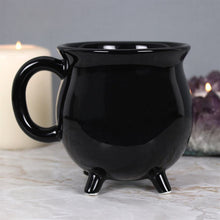 Load image into Gallery viewer, Black Cauldron Mug.  This brilliant black mug is designed to look like a cauldron, perfect for anyone who likes to channel their inner witch.  The mug will come in a matching cardboard box.